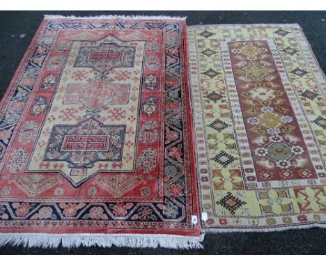 Two vintage style tassel ended carpets