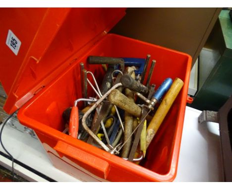 Plastic red container with various hand tools 