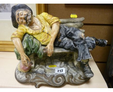 Capodimonte figure of an inebriated old man on a bench