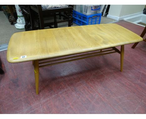 Ercol light wood coffee table with under tier spindle rack