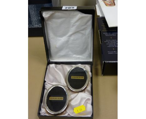 Pair of boxed oval miniature sterling silver portrait frames