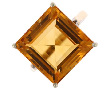 A 9ct and 14ct gold citrine dress ring, square step-cut citrine measures: 14.40 x 14.30 x 8.56mm, size K, 6.6gNo damage or re