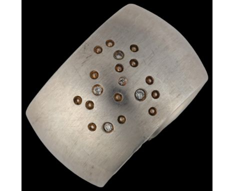 QUINN - a heavy sterling silver diamond band ring, set with modern round brilliant-cut diamonds, total diamond content approx