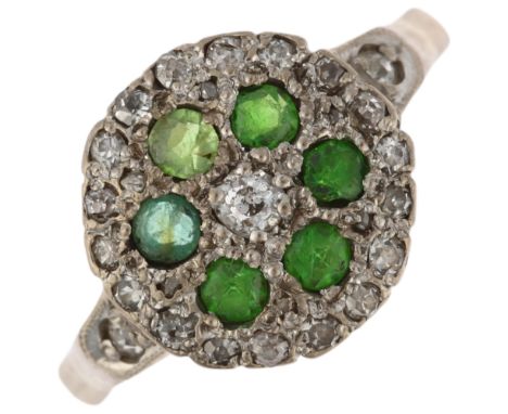 A late 20th century 18ct gold green stone, demantoid garnet and diamond circular cluster ring, maker JM Co, London 1984, pave