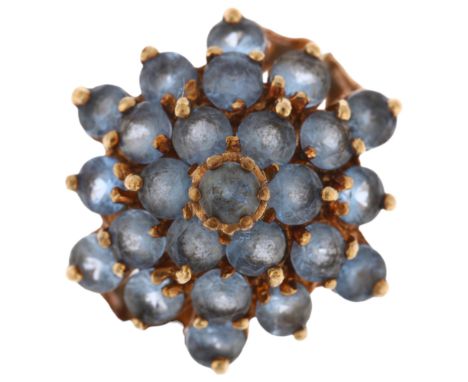 A 9ct gold blue topaz flowerhead cluster ring, maker CL&S, London 1975, setting height 18.4mm, size P, 4.7gNo damage or repai