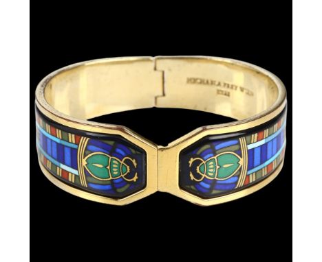 MICHAELA FREY - a gold plated enamel Egyptian Revival scarab beetle hinged bangle, signed, setting height 22mm, internal circ