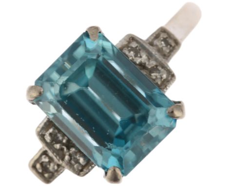 An Art Deco 18ct white gold blue zircon and diamond ring, claw set with octagonal step-cut zircon and single-cut diamond step