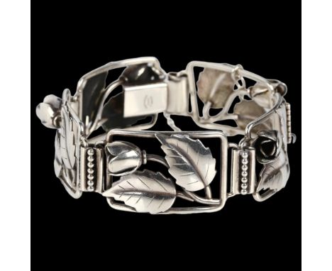 JOHN LAURIDSEN - an Art Deco Danish stylised silver rose floral panel bracelet, band width 21mm, internal circumference 18.5c