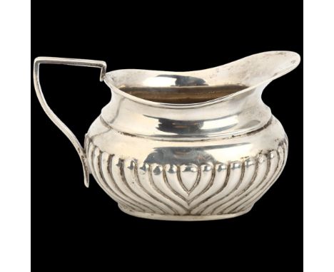 A Victorian silver cream jug, John Wilmot, Birmingham 1897, relief embossed half fluted decoration, 6cm, 1.9ozBody has a few 