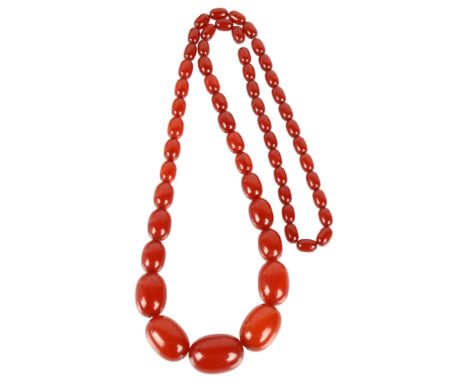 A single-strand graduated cherry amber bead necklace, beads measure: 29.4-11.7mm, 76cm, 76g1 bead missing, otherwise no damag