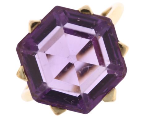 A late 20th century 9ct gold amethyst dress ring, claw set with hexagonal step-cut amethyst, setting height 17.3mm, size M, 6