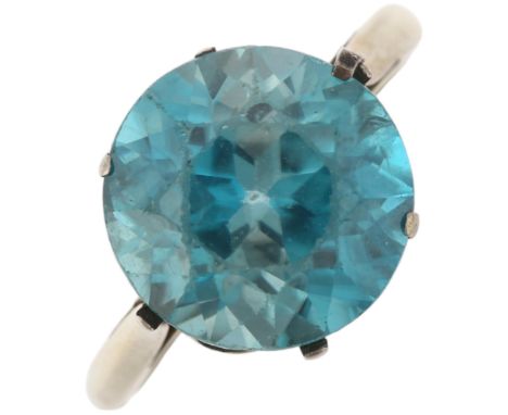 An Art Deco 18ct white gold solitaire blue zircon ring, claw set with round-cut zircon, measures approx: 11.26 x 7.30mm, size