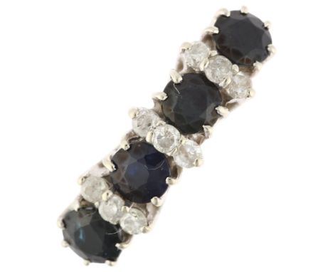 A late 20th century 18ct gold sapphire and diamond half hoop ring, maker BVA, London 1990, claw set with round-cut sapphires 