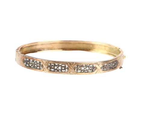 A Victorian openwork hinged bangle, circa 1900, unmarked gold settings, band width 7mm, internal circumference 16cm, 7.5gSeve