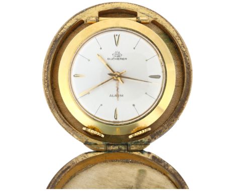 BUCHERER - an Art Deco style Swiss gold plated keyless alarm travelling bedside clock, circa 1960s, silvered dial with gilt a