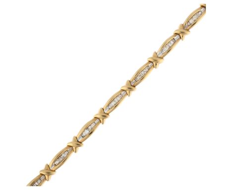 A 9ct gold diamond line bracelet, set with tapered baguette-cut diamonds, total diamond content approx 1ct, 18cm, 11.6gAll st