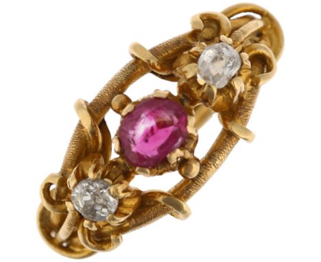 A Victorian three stone ruby and diamond openwork ring, with textured wirework shank, setting height 9.4mm, size H, 3gNo dama