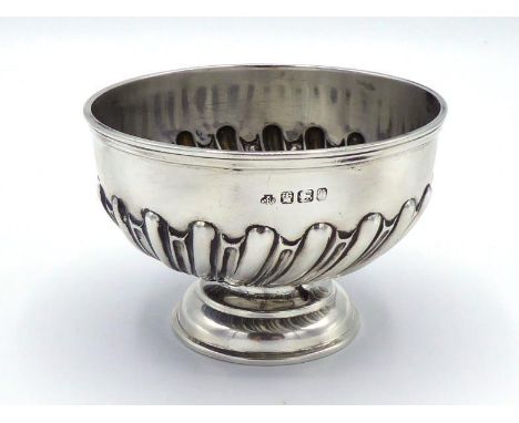 A small late Victorian silver sugar bowl by William Hutton & Sons Ltd., Sheffield, 1898, with batswing-fluted sides, 8.6 cm. 