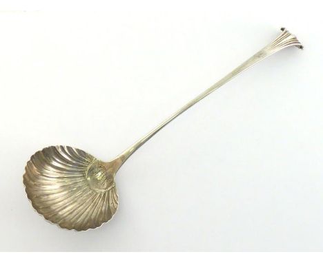 An early George III Onslow pattern silver soup ladle by George Baskerville, London, 1761, the inside of scalloped bowl engrav