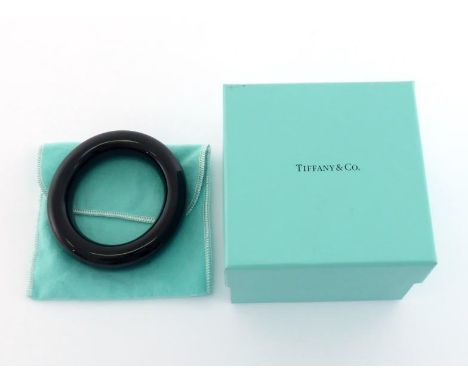 TIFFANY & Co. an Elsa Peretti brown lacquer over hardwood 'Doughnut' bangle, signed, 63mm diameter, in a Tiffany pouch and bo
