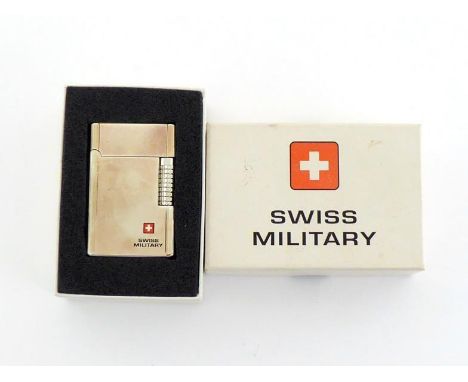 A Swiss Military stainless steel cased gas cigarette lighter in original box. In very good condition. 