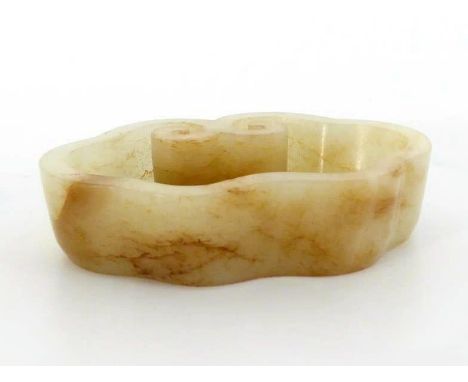 A Chinese carved white jade scholar's brush washer, in the form of Lingzhi, stone in even white colour with slight brown surf