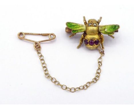 A Victorian ruby, diamond and enamel brooch, modelled as a bee, the body set with rose cut diamonds, three small rubies to th