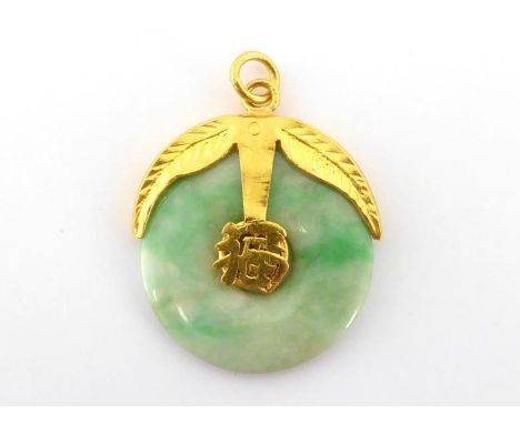 A jade bi, mounted with calyx style bale, a Chinese character to the centre, stamped '24ct', 24mm wide, 7.3gms 