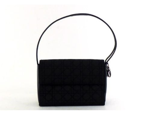 A Christian Dior quilted handbag with leather handles and logo charm. Labelled inside Christian Dior Paris Serial #MUO 918 Ma