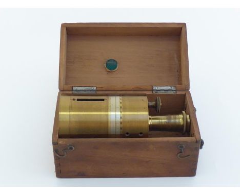 An early 20th. century lacquered brass enclosed surveyor's cross with sensitive long needle compass, sighting slots and micro