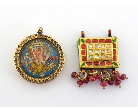 Two Indian pendants, the first circular frame set with a small painted miniature of Ganesh, 22mm diameter; the second box pen