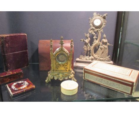 A gilt brass clock case with a J. Williams of Dublin watch movement, another watch holder, a tortoiseshell snuff box, a comme