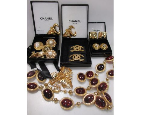 A pair of Chanel ear clips, boxed, a pair of Chanel shoe buckles, a Valentino faux amber and gilt metal necklace together wit