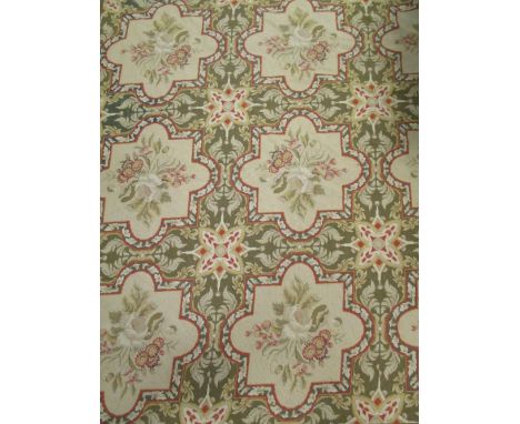 A green ground Aubusson needlework carpet, 415 x 300cm Overall in average condition a bit yellow and dirty.