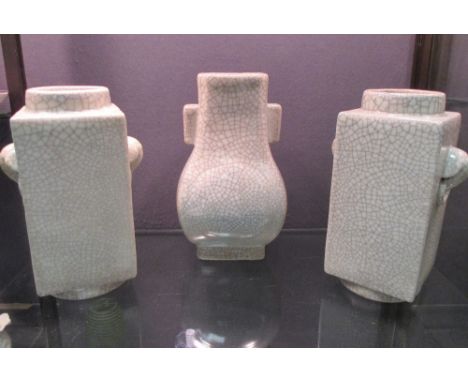 A pair of cong shaped crackleware vases, 28.5cm high together with a crackleware arrow vase, 30cm high (3) 