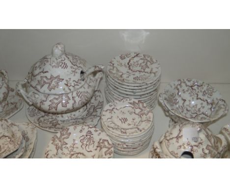 A Victorian child's pottery service printed in brown with sprigs of foliage and shards of ice, comprising: soup tureen, cover