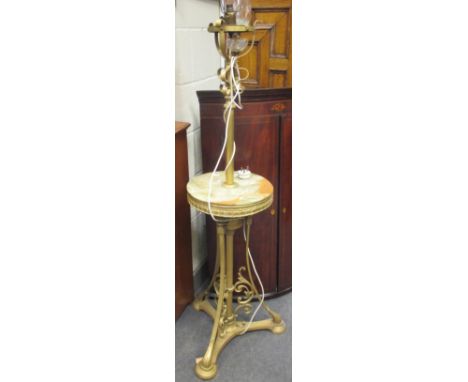 An onyx and gilt metal standard lamp and a brass oil lamp and shade (2) 