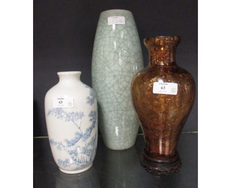 A Chinese crackled celadon vase, 31cm high, an amber glass vase with silver leaf inclusions, 21.5cm high, a wood stand and a 