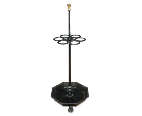 A 19th century cast iron stick stand, with octagonal tray base, on lion paw feet 99cm high x 39cm wide Later painted, no appa