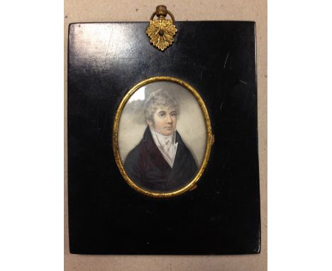 English School  (early 19th Century) A portrait miniature of a man in a black jacket and white stock watercolour on ivory an 