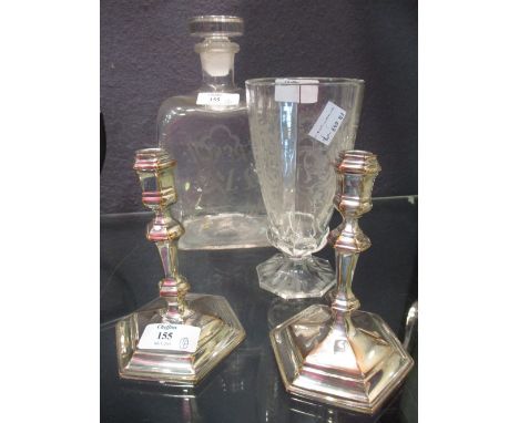 A pair of small plate candlesticks, a rectangular glass decanter engraved 'French' and 'L&MS' and an engraved water glass 