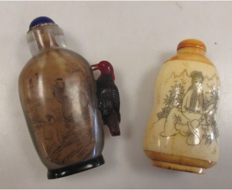 A Chinese bone snuff bottle together with another interior painted and pecked by a ruby glass woodpecker 
