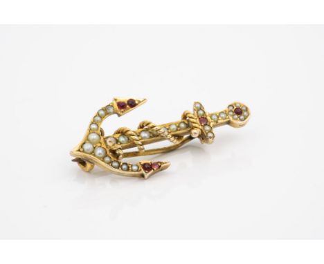 An Edwardian 18ct gold, seed pearl and garnet anchor brooch, 3.5cm. long.