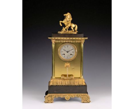 A French bronzed and gilt brass Empire style mantel clock with twist fountain by Laine of Paris, the eight day movement with 