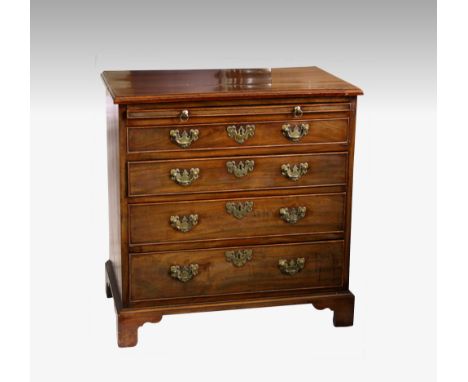 A George III mahogany bachelor's chest, the moulded top over a brushing slide and four graduated drawers with the original br