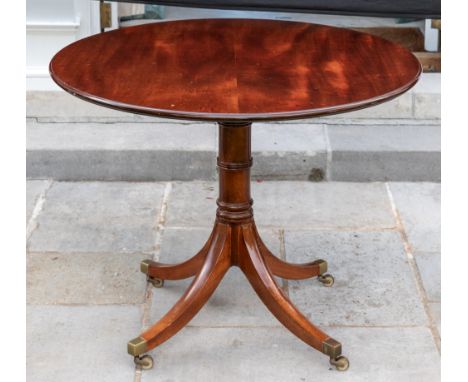 A George III style mahogany circular centre table, modern, by William Tillman, on ring-turned stem and squared downswept legs