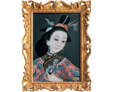 A pair of Chinese Qing Dynasty reverse paintings on glass, late 18th / early 19th century, each of a young noble lady, her dr