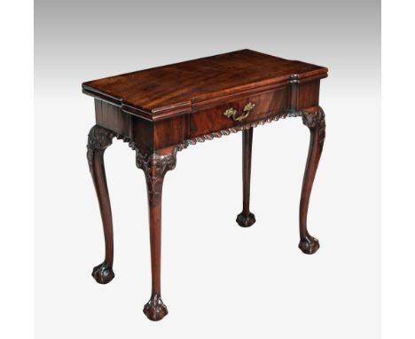 A George II red walnut rectangular card table, the eared top with shallow square counter well, lined with green baize, openin