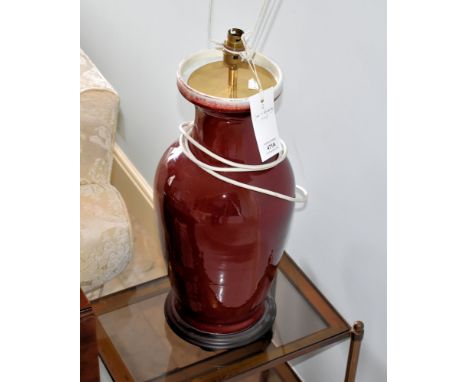 A pair of Oriental vase lamps, 20th century, baluster form, in flambé glaze, 22in. (56cm.) high; together with a smaller Orie
