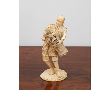 A Japanese carved ivory figure of a peasant, Meiji period (1868-1912), holding a basket of flowers, a stick in his right hand